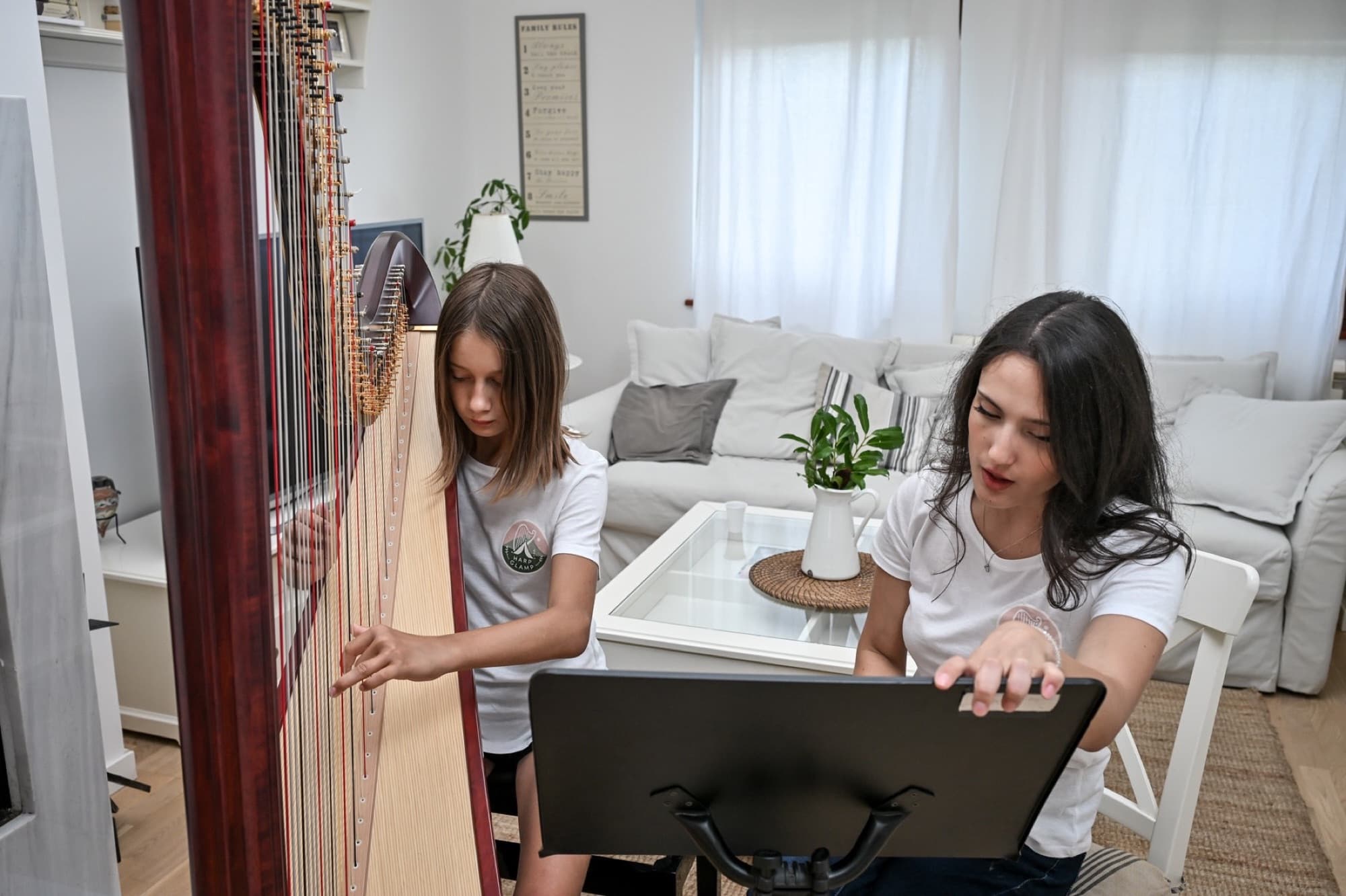 Irina teaching a young harp student during a lesson